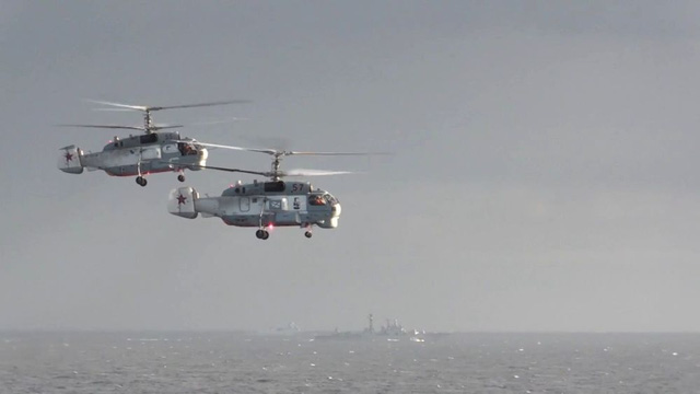 
Hai trực thăng chống ngầm Ka-27 tuần tra quanh khu vực triển khai của các tàu chiến Nga ngoài khơi Syria. (Ảnh: Bộ Quốc phòng Nga/Sputnik)

